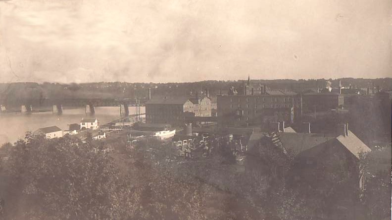 Panoramic photo showing Johnson & Johnson and railroad bridge