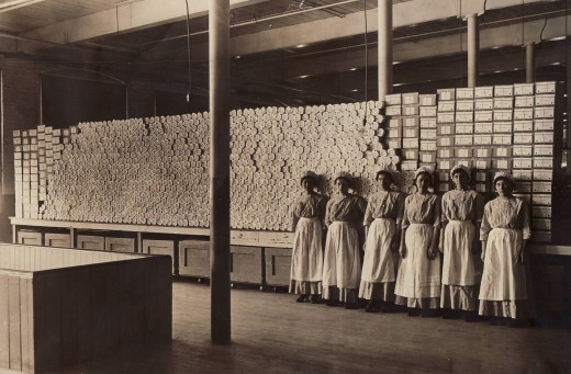 Employees in the Johnson & Johnson Cotton Mill in 1915 stand in front of surgical dressings.