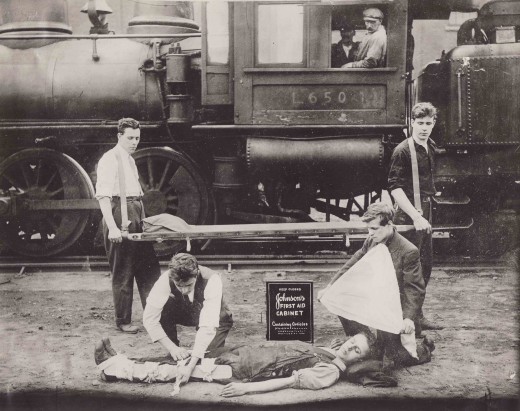 Railroad First Aid demonstration with a Johnson &amp; Johnson First Aid Kit, 1916.  From our archives.