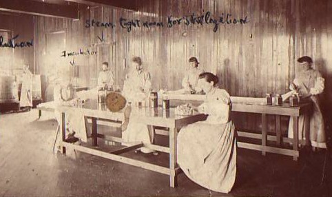Women demonstrate pioneering sterile preparation of gauze and ligatures in 1891, in one of the earliest photos in the Johnson & Johnson archives.