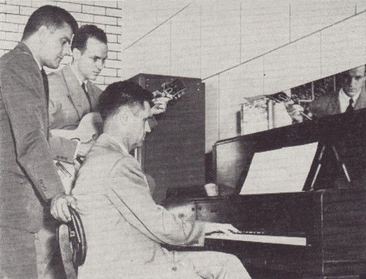 Vinnie Utz (far left) supervises an employee music session for the Johnson & Johnson radio show he managed during the 1940s.  From our archives.