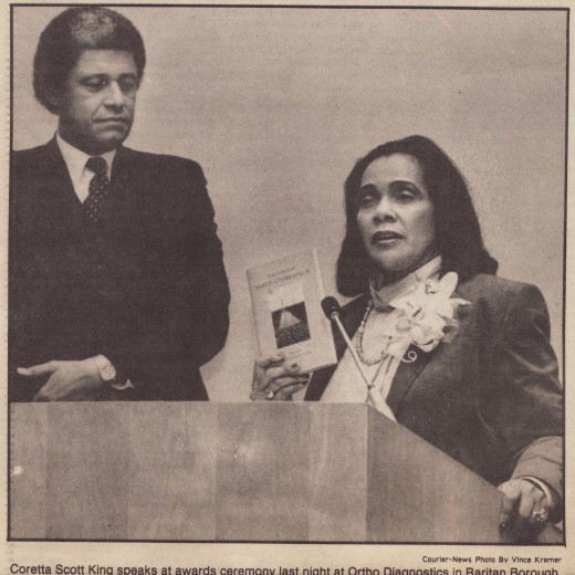 Aldrage B. Cooper speaks at an awards ceremony with civil rights leader Coretta Scott King, at a Johnson & Johnson facility in Raritan, NJ, 1985. From our archives.