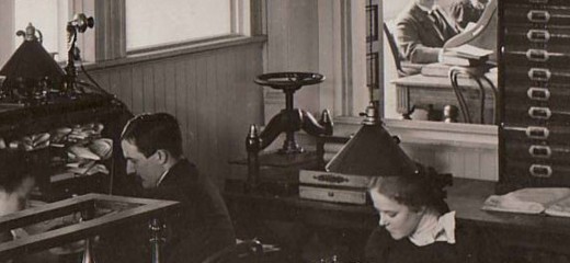 Close up view of part of the Johnson & Johnson offices in 1895 showing one of the company's candlestick phones on the left.  From our archives.